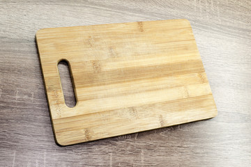 old wooden cutting board on the table