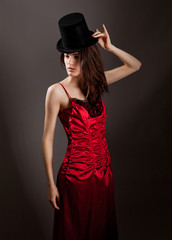 Woman in Top Hat and Red Satin Dress