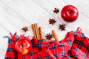 
Christmas winter background, red apples with cinnamon, spices , Christmas cookies and cocoa on a...