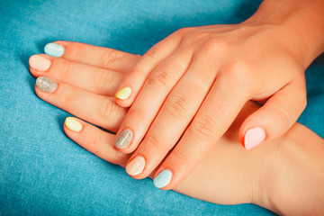 Woman hands with color nail polish. Manicure.