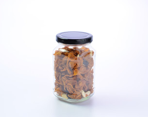 Granola Cereal in bottle on white background