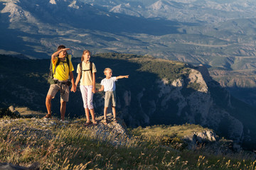 Family walking at the mountains - 96047837