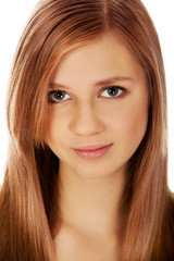 Naklejka premium Teenage woman smiling in cheerful mood
