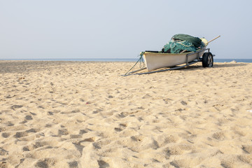 Fototapeta na wymiar Small old fishing boat on the beach.