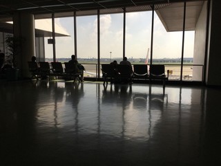 Silhouettes at the gate in airport