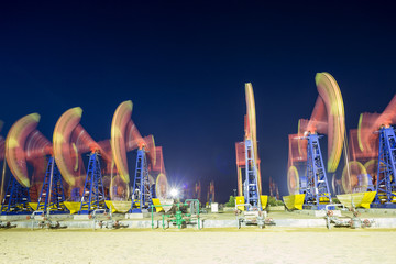 working oil-rig of oilfield day and night