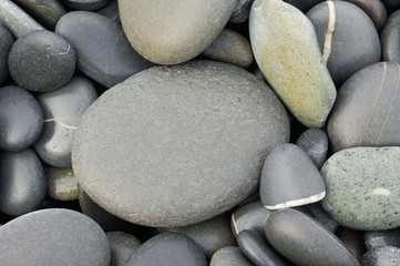 Fototapeta na wymiar Beach wet pebbles background