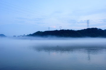 lake, hill and reflection in fog