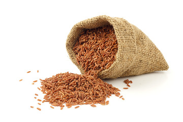 Red rice on white background