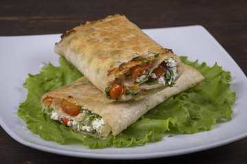Pita bread wrapped with cottage cheese and vegetables