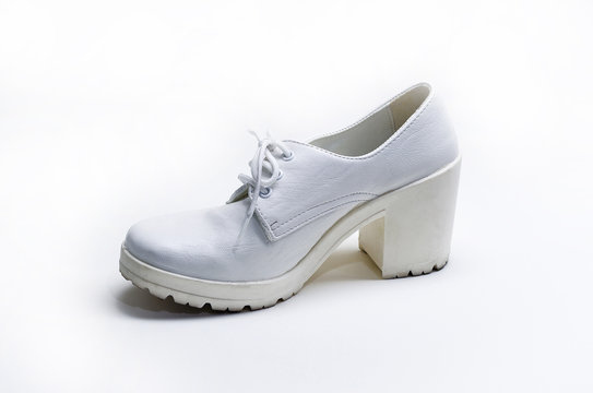 Used white leather woman shoe on white background