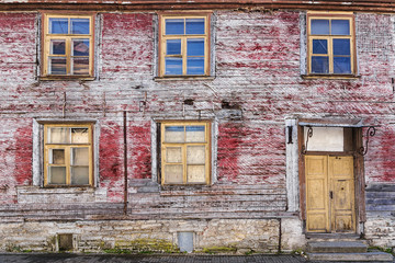 facade of an old abandoned wooden house