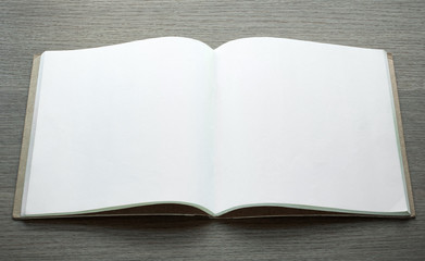 blank open book on dark wood background