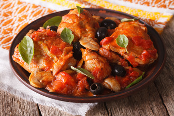 Homemade Cacciatori chicken on a plate close-up. horizontal
