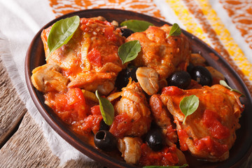 Cacciatori chicken with mushrooms on a plate close-up. horizontal
