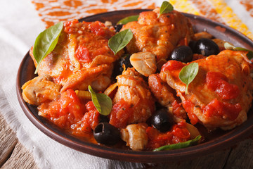 Italian cuisine: Cacciatori chicken with mushrooms closeup. horizontal
