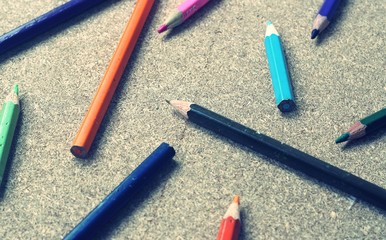 Colour pencils on wood background