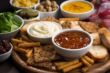 assortment delicious appetizers with different sauces