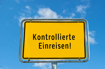 Controlled entry Ortstafel sign board against cloudy sky