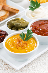 assortment sauces and snacks, vertical, closeup