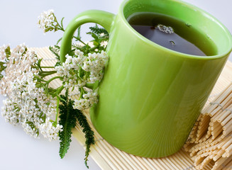 Achillea millefolium plant with flowers / fresh Yarrow tea - herbal homemade remedy
