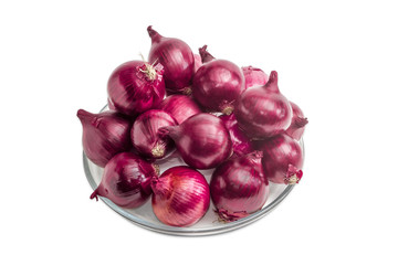 Pile of red onion on a glass dish