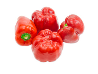 Four bell peppers on a light background