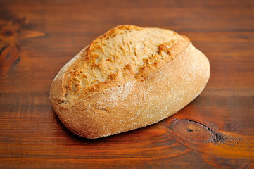 Freshly baked traditional bread on wooden board
