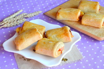 Roll out puff pastry stuffed with cheese and ham