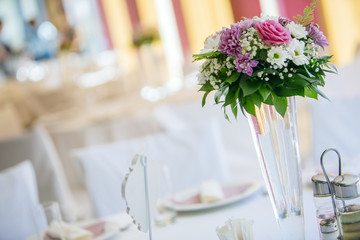 Beutiful wedding setting with bouquet