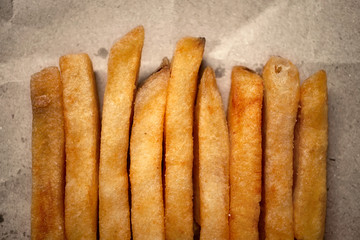 french fries on craft paper background
