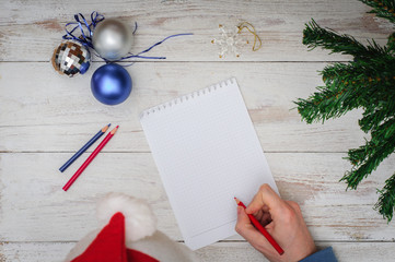 Man writing letter to Santa in Christmas situation