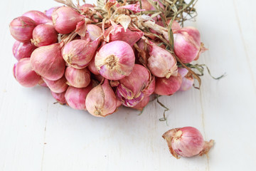 red onions on  wooden background
