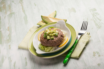 healthy hamburger with avocado and lettuce salad