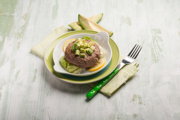 healthy hamburger with avocado and lettuce salad