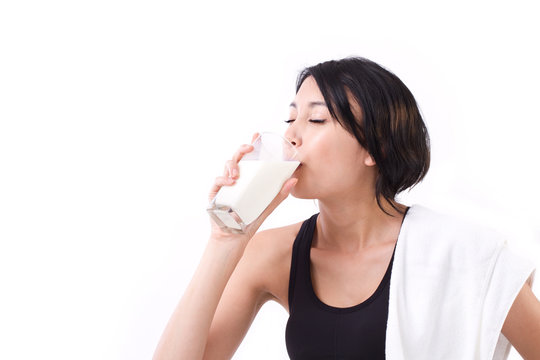 beautiful sport woman drinking milk