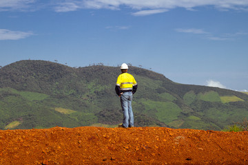 Mining construction worker on mountain top in Africa