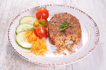 vegetarian patties, bulgur galette and salad