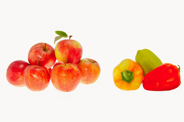 Fototapeta na wymiar Red ripe apples and sweet pepper on a white background