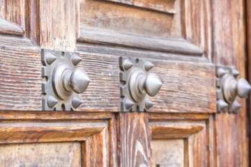 Iron decorative detail in a wooden door