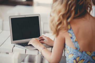 Morning coffee a business woman in a summer cafe 
