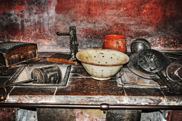 Fototapeta na wymiar old pots and dishes in a rustic kitchen