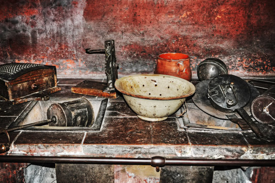old pots and dishes in a rustic kitchen