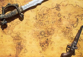 Old treasure map with sword and musket gun.