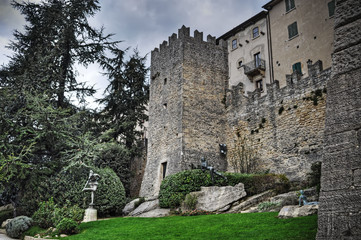 Fototapeta na wymiar San Marino city wall under clouds