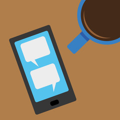 Above view of a mobile phone and a cup of coffee with open blank text message bubbles on the screen of the cell phone