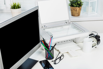 Working place of a business person. Computer, printer and other office supplies