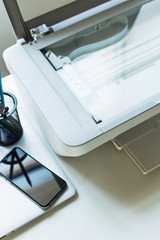 Working place of a business person. Computer, printer and other office supplies