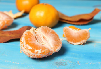 Tangerines on a blue wooden board