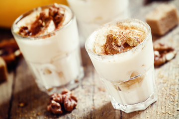 Fresh homemade dessert of bananas, yogurt and nuts, selective fo